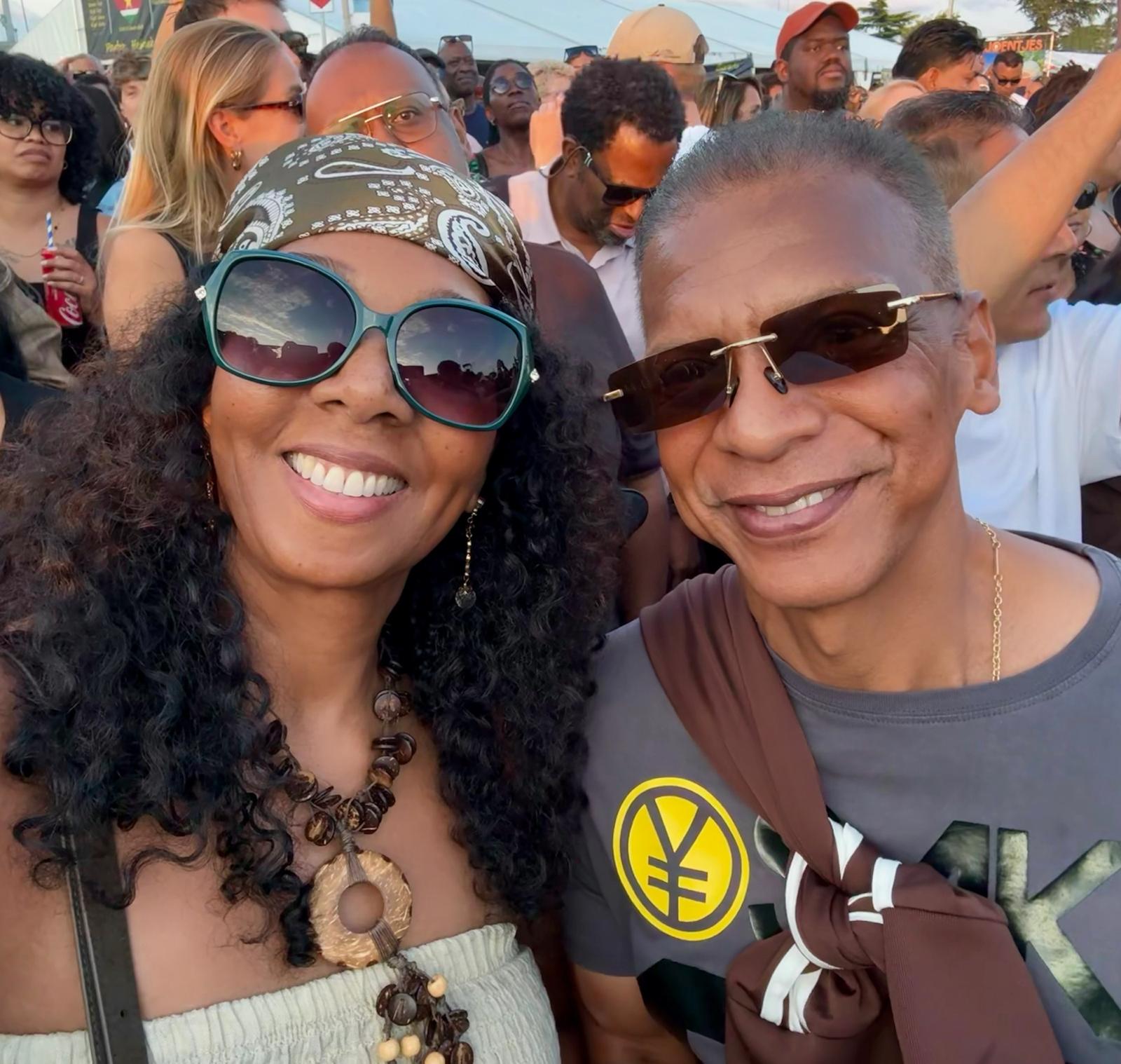 Sandra and Maikel smiling together outdoors