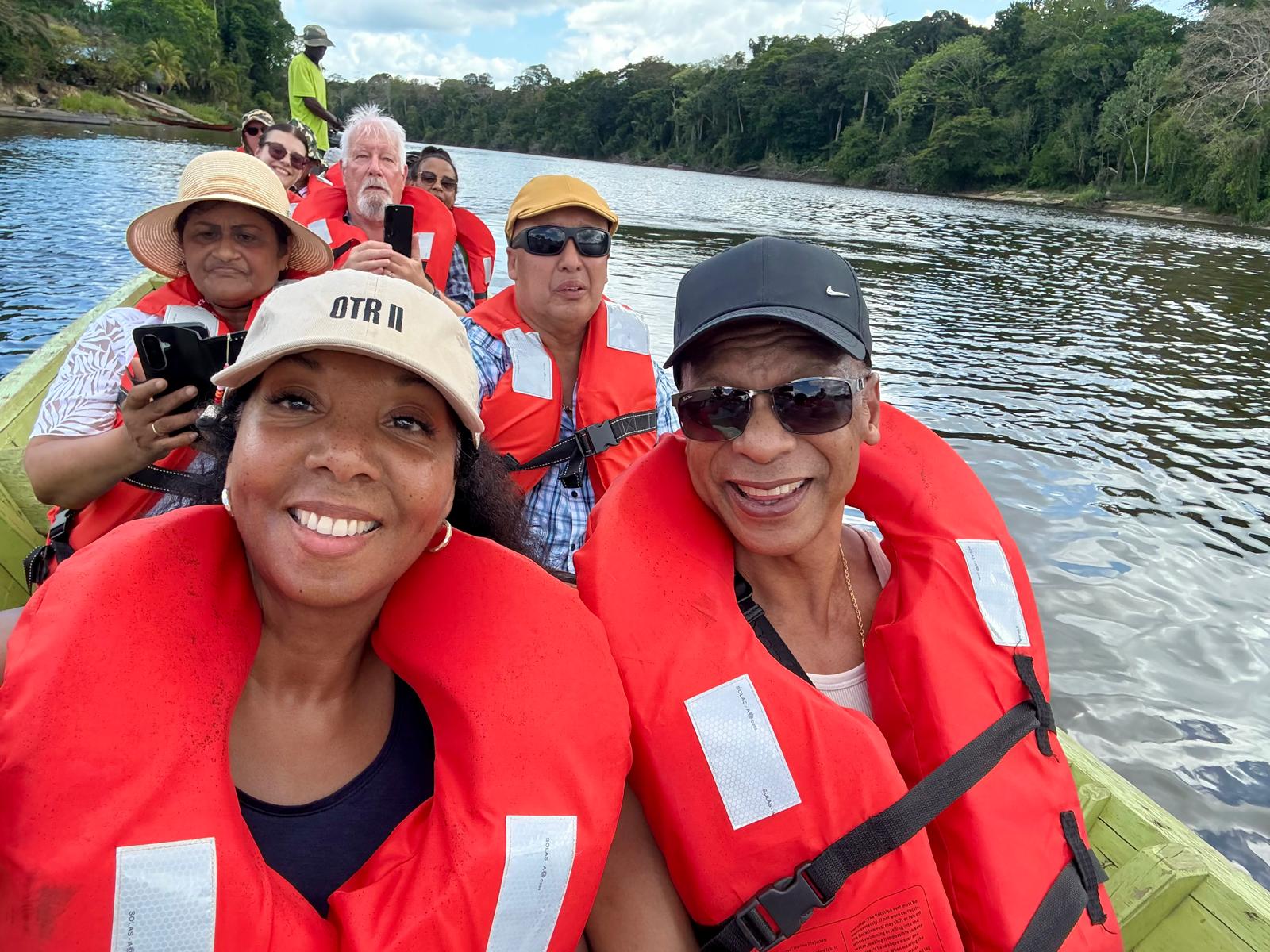Health Tribe couple and friends enjoying a river boat trip